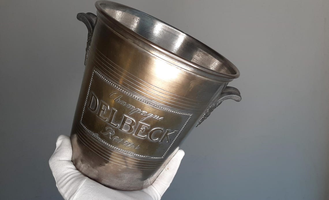 ANTIQUE 100 YEARS OLD Delbeck Champagne ice bucket classic-shaped cooler Made in France by Argit Plaques on both sides Rigid pewter handles