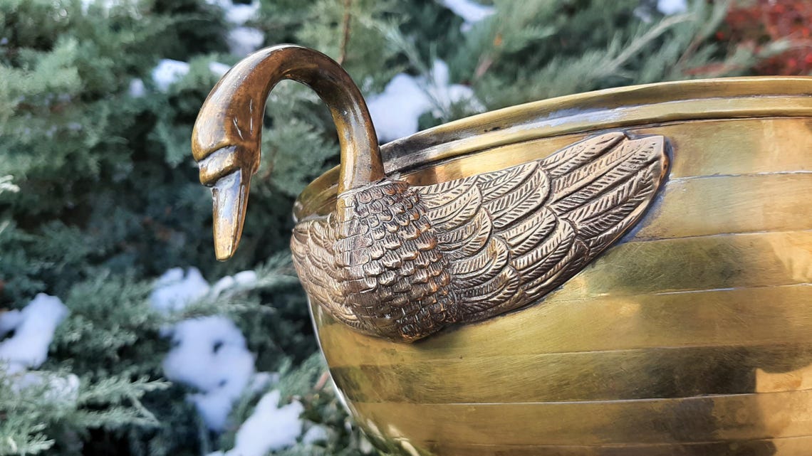 A copper champagne or wine cooler tray with swan-shaped handles